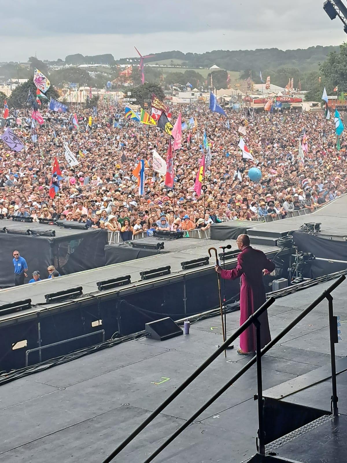 Bishop Michael looks out at the crowd at Glastonbury Festival