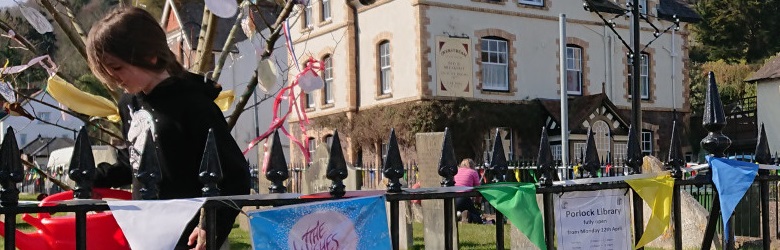 Children decorating church railings in Porlock