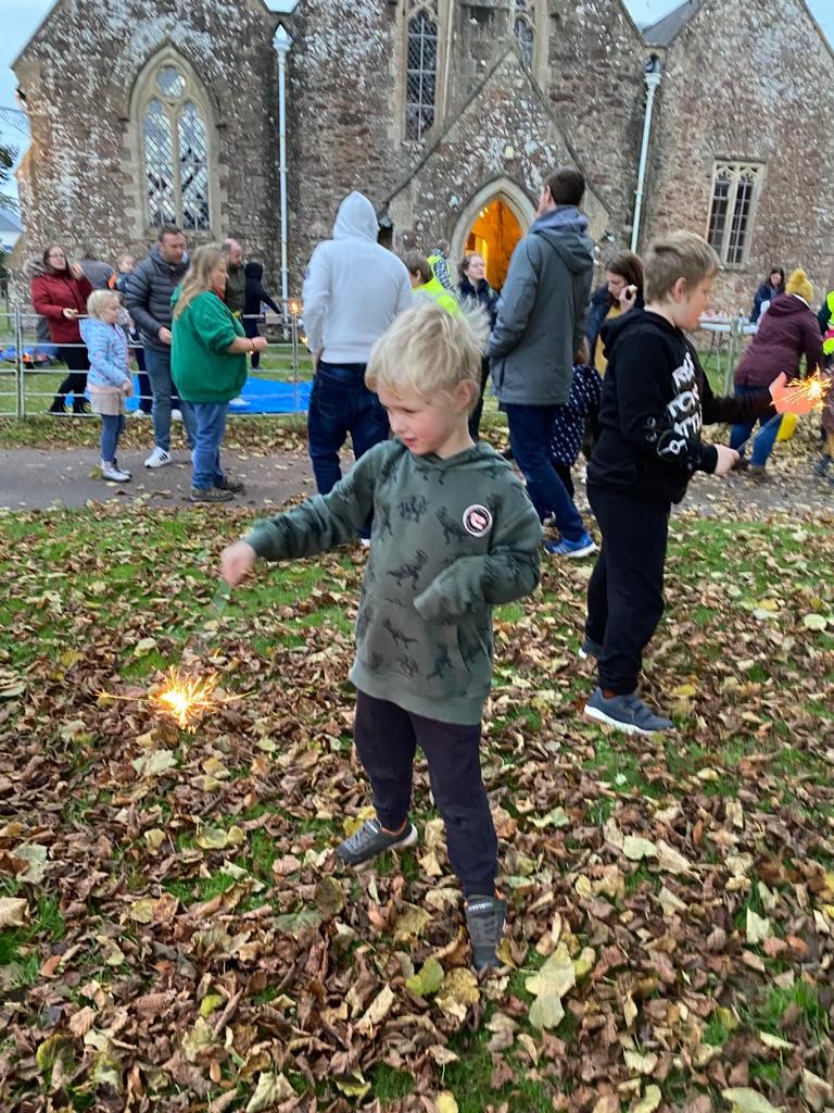 Children playing with sparklers at Campfire Church