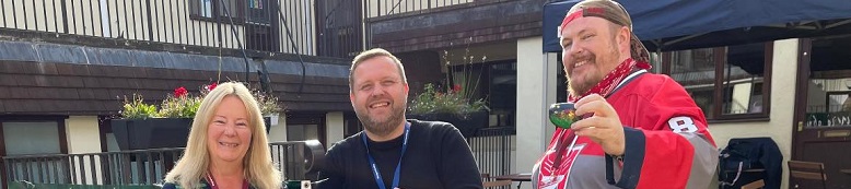 Trevor James (centre) Keynsham Pioneer with two local people