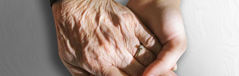 Young and old hands together