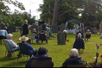 Open Sunshine and deckchairs – Sunday service in the church grounds